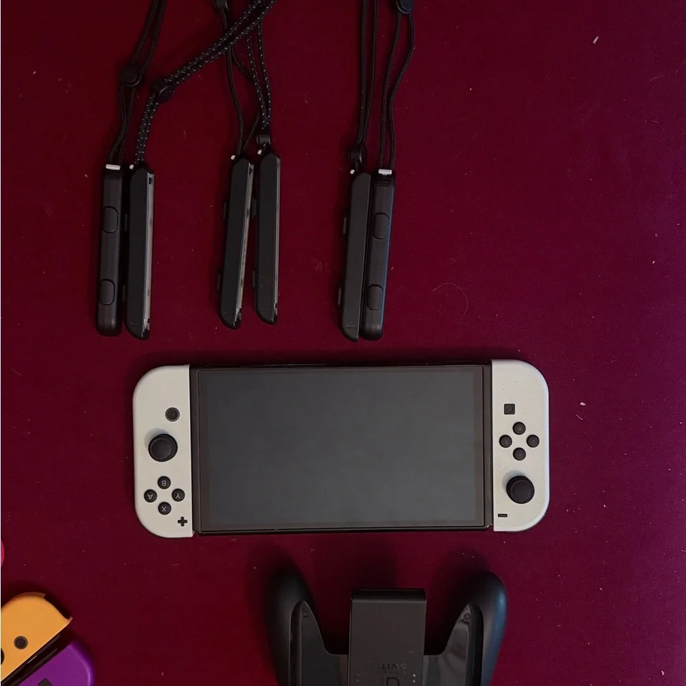 Nintendo Switch with Red, Blue, Yellow, and Purple Joy-Cons